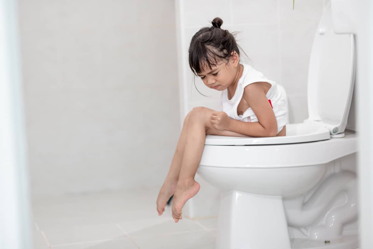 A child struggles with constipation — the books "The Ins and Outs of Poop" may help.
