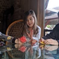 3 kids playing at kitchen table