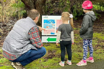 PopUp StoryWalk: Follow the trail to find the next page of a children's book.