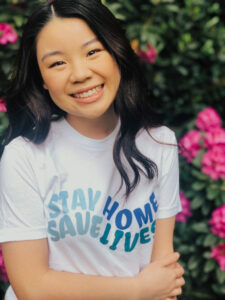 Madison Chan wearing one of her shirts.
