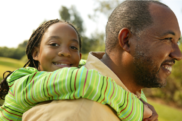 girl getting piggyback from dad