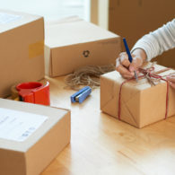 Shipping: woman preparing package for shipping