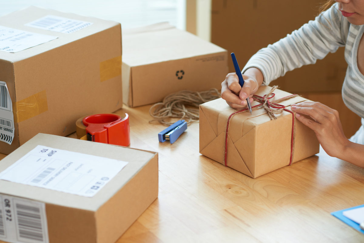 Shipping: woman preparing package for shipping