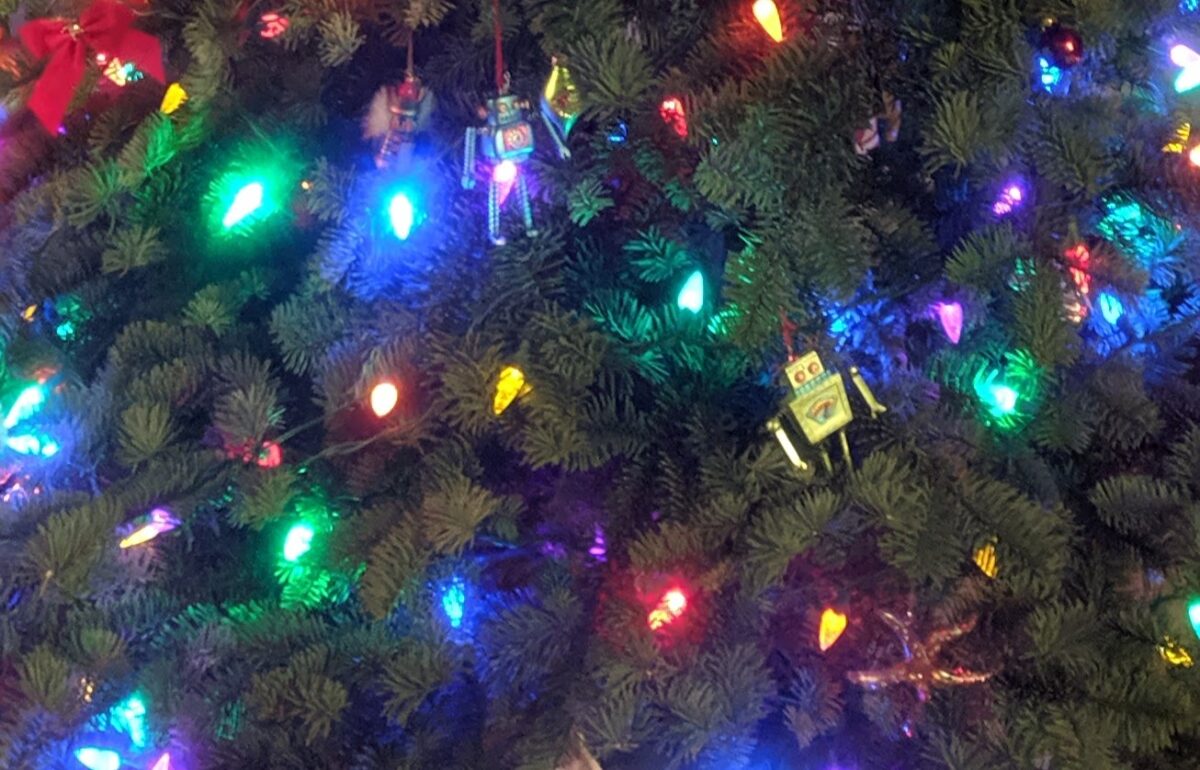 Close-up of glowing holiday lights on a Christmas tree
