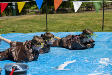 Child participates in the human slug race during Slug Fest at Northwest Trek Wildlife Park
