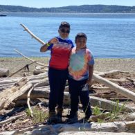 Boys standing at the Blake Island Beach