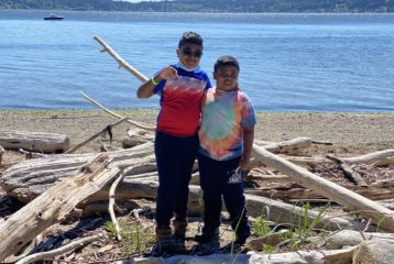 Boys standing at the Blake Island Beach