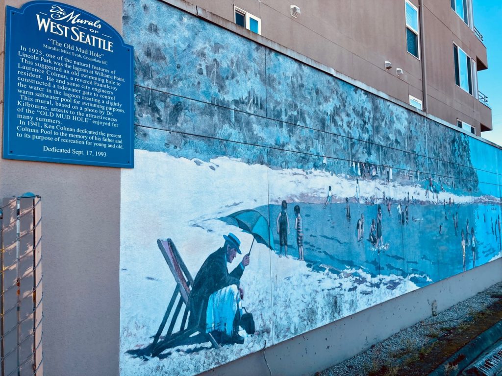 Look for large murals on West Seattle buildings