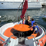 Family sitting on the Seattle Donut Boat ready to take off to see the city skyline