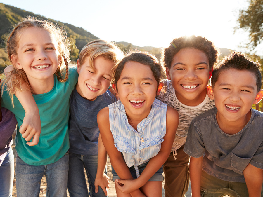 Apex Social Group - Children smiling at camera