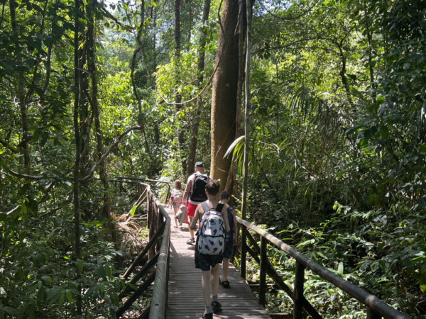 Family walking across a bridge- activities are based around the time of day where the neurodiverse child has the most patience.