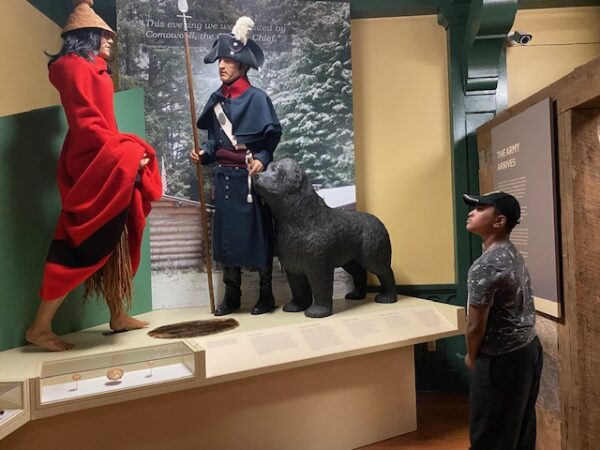 A child looks on to learn more about the relationship of Indigenous people to soldiers at the Lewis Army Museum.