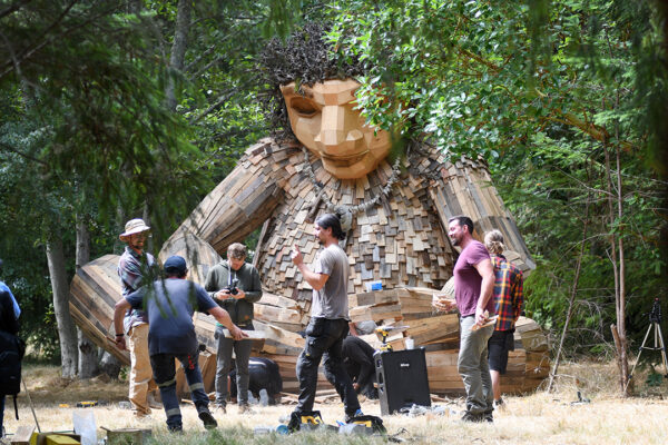 Team of artists rejoice as they finish making the huge troll sculpture