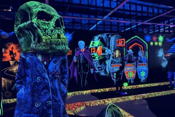 Glow in the dark decorations around a mini gold course