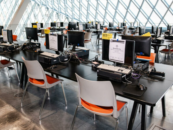 Library cyber attack impacts empty chairs at computer terminals