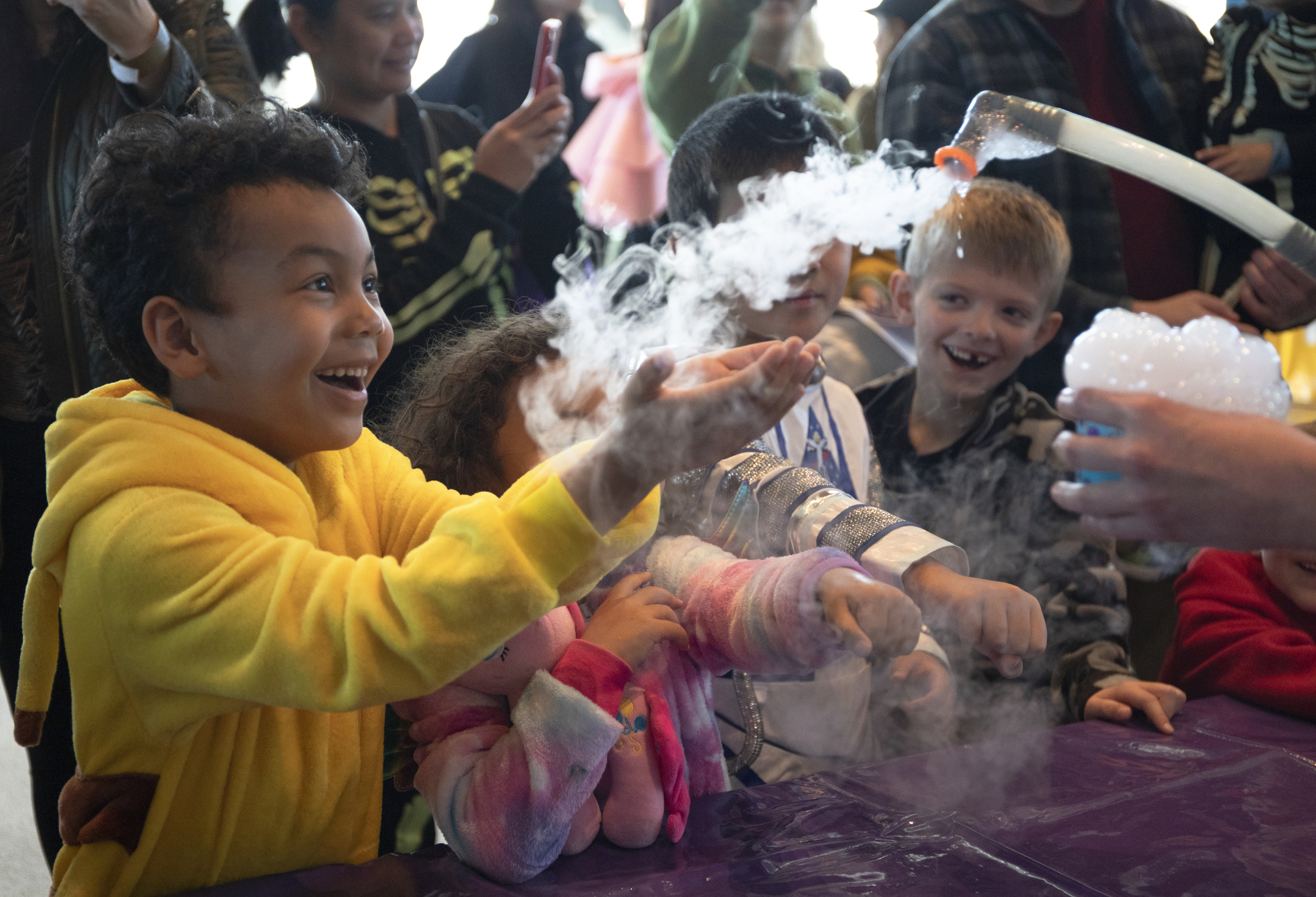 Child playing with Halloween-themed activities at the Museum of Fright in Seattle, a kid-friendly Halloween event.