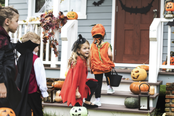Kids in costumes trick-or-treating during a free Halloween event in Seattle.