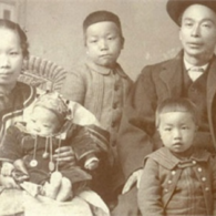 Historical photos of a Chinese family, showing mother holding small infant, and father standing next to two young children.