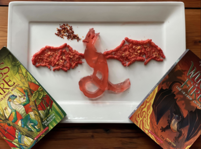 Red dragon laid on a plate made out of hot cheetos.