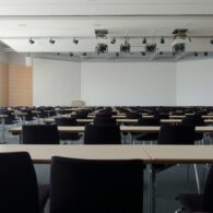 Empty chairs lined up in generic classroom
