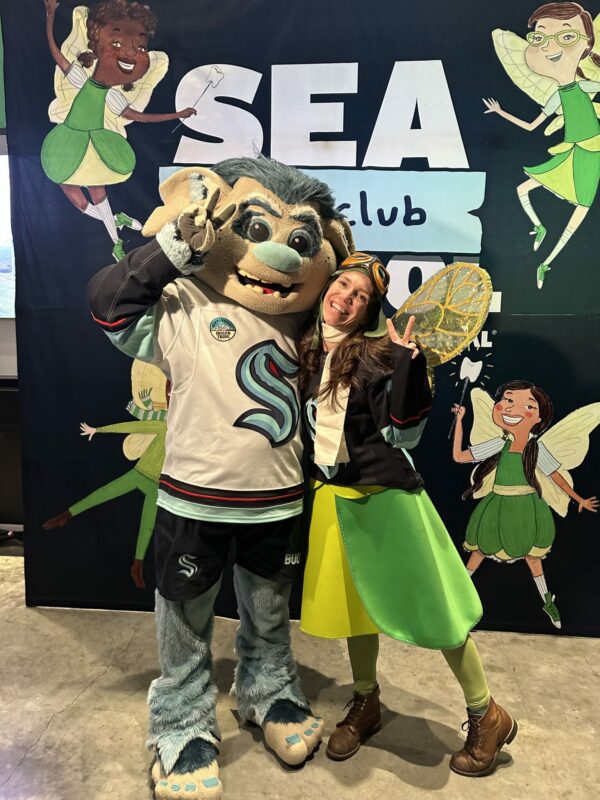 Buoy the Kraken mascot poses with the Tooth Fairy.