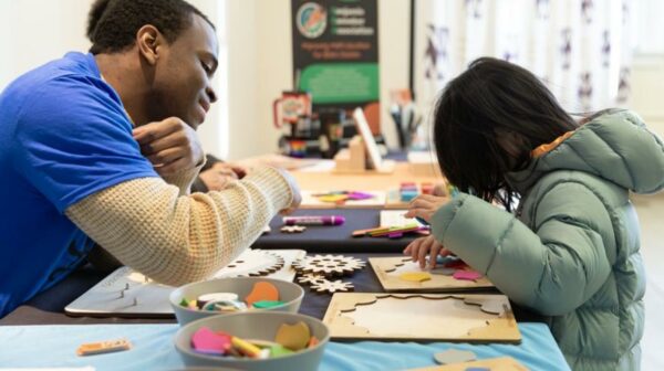 • Children and adults creating art together during a hands-on program at the Northwest African American Museum in Seattle