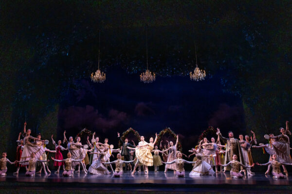 Entire company of dancers pose on stage