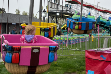 Kid rides in hot air balloon cart