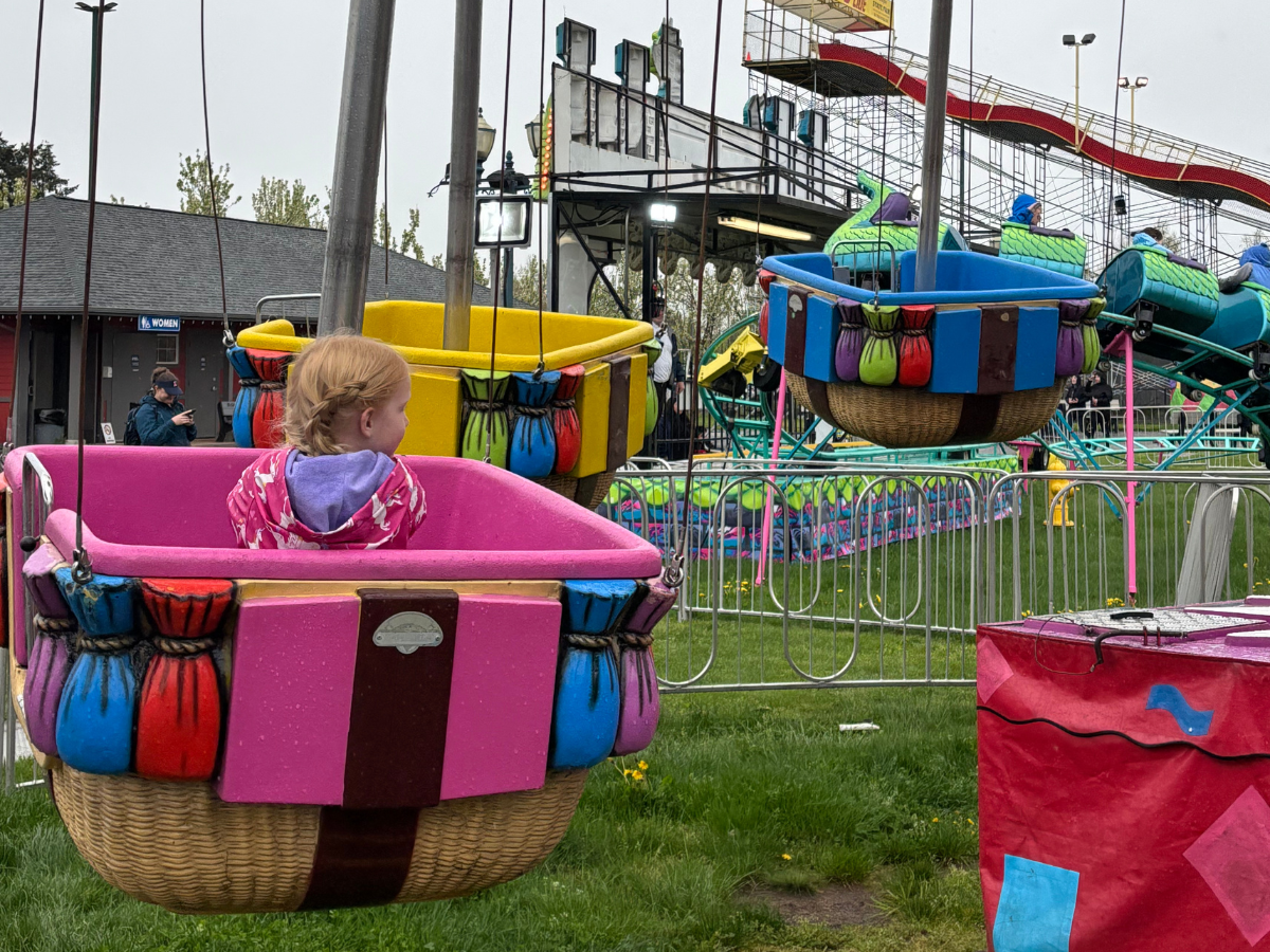 Kid rides in hot air balloon cart