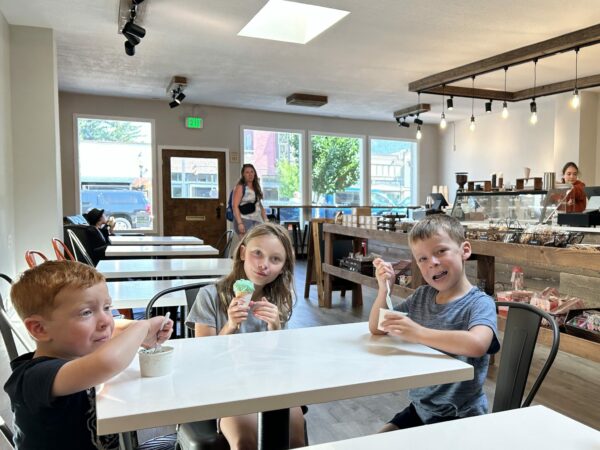 Kids eating ice cream in shop