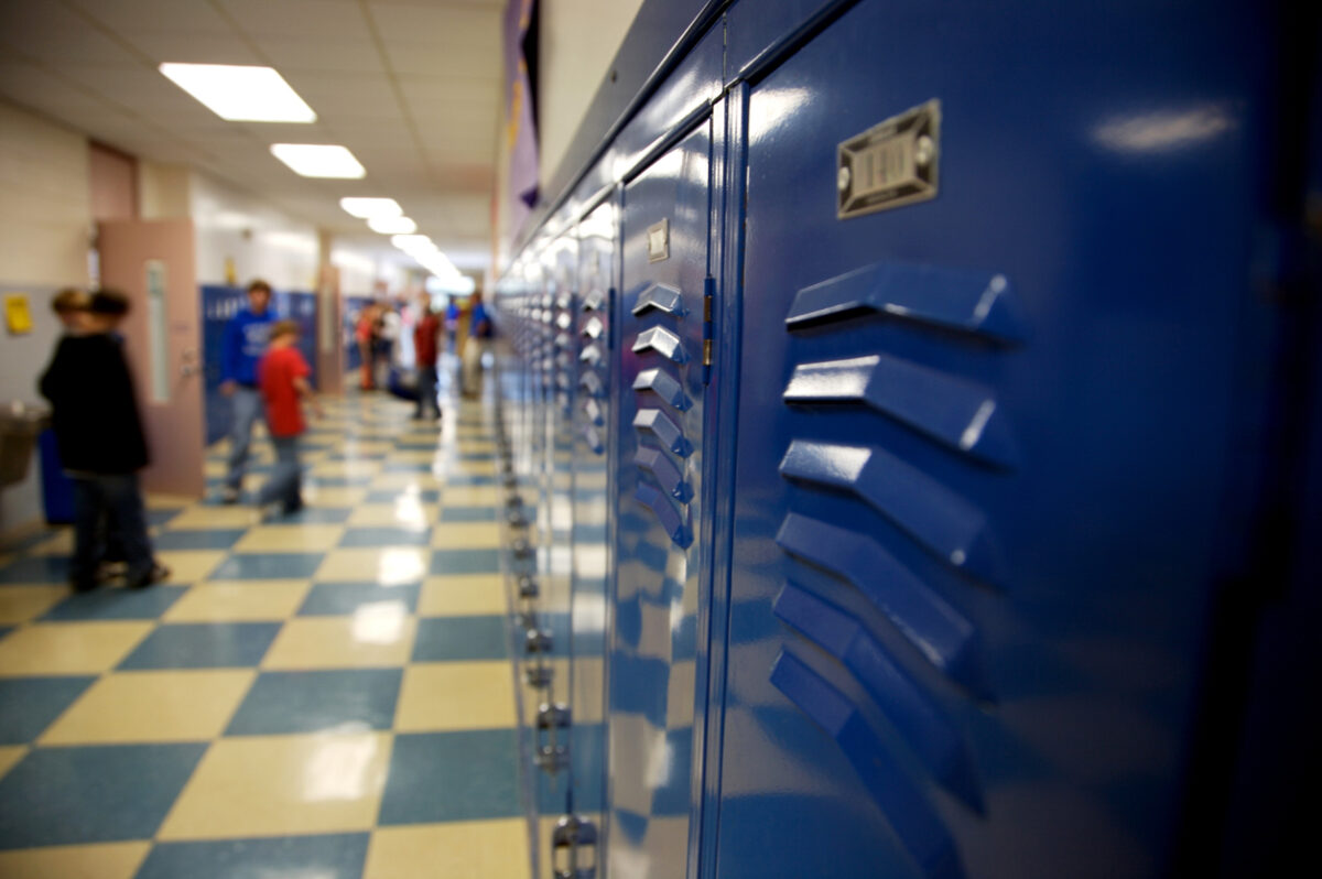 Empty school hallway lined with lockers, symbolizing the start of the school year.