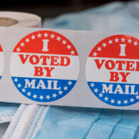 “I Voted” stickers in red, white, and blue on a table for the King County election