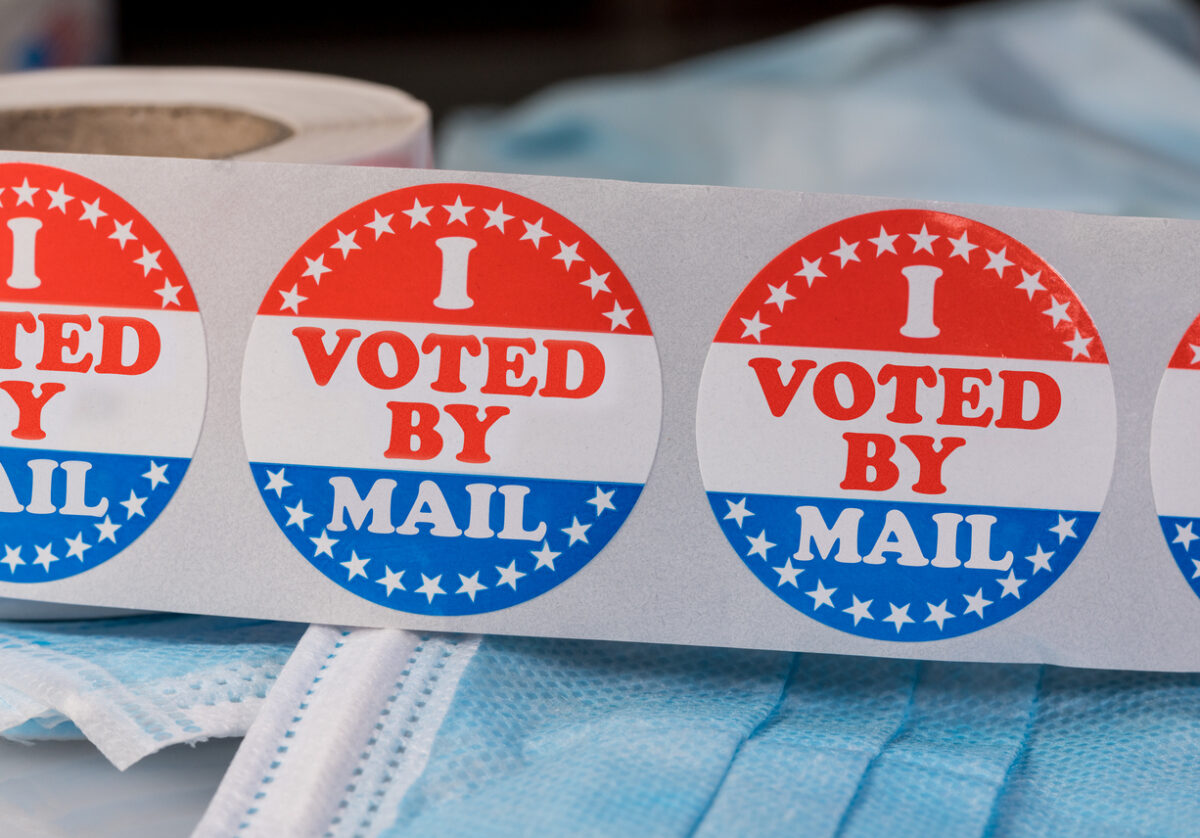 “I Voted” stickers in red, white, and blue on a table for the King County election