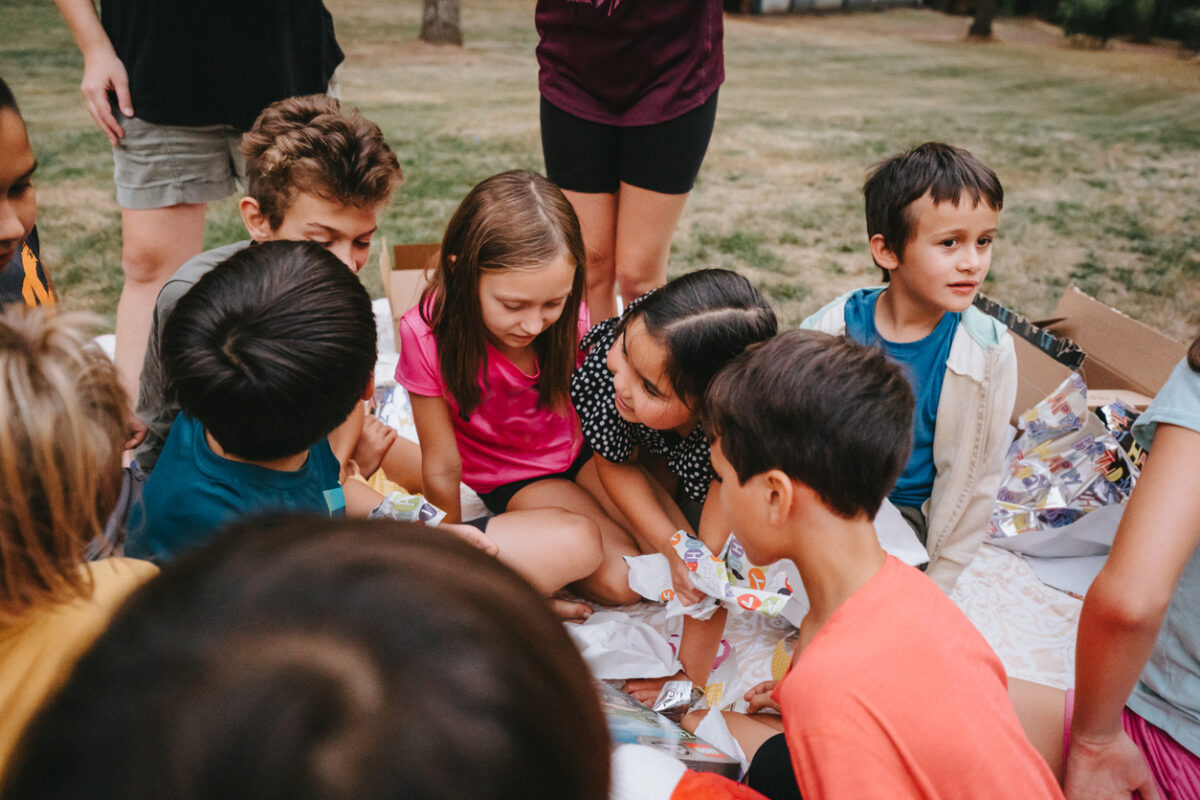 Children playing together at school, smiling and interacting