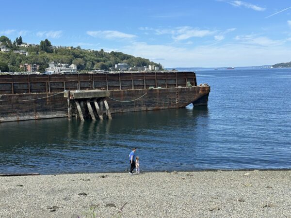 Parent and child walking along the rocky beach at Jack Block Park