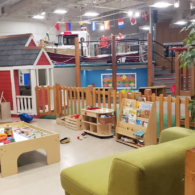 Main Street exhibits at the Children’s Museum of Skagit County in Burlington, featuring a tugboat, grocery store, and construction zone.