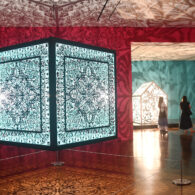 Illuminated sculptural installations casting intricate light and shadow designs.