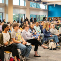 Families, students, and candidates engage in discussion during the Seattle Education Forum at Rainier Beach High School, focused on education equity, housing, and school safety.