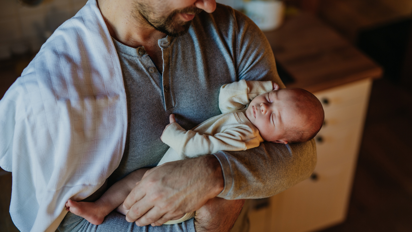 father holding baby