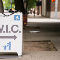Seattle, USA - June 9, 2014: A women infant children welfare sign outside a king county health center mid day downtown on fourth avenue.