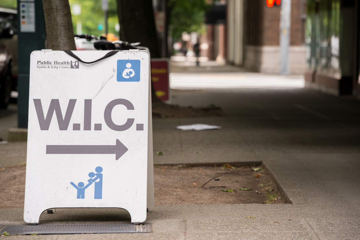 Seattle, USA - June 9, 2014: A women infant children welfare sign outside a king county health center mid day downtown on fourth avenue.