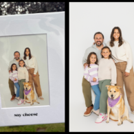 A family of four and their dog posing together in a printed portrait from Seattle’s Say CHEESE selfie studio, held up outdoors in its white photo mat.