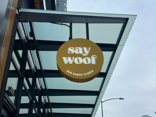 Exterior sign for Say Woof and Say CHEESE selfie studio in South Lake Union, Seattle.