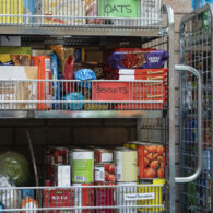 Close up of a shelving unit containing nonperishable food in storage at a food bank in the North East of England.